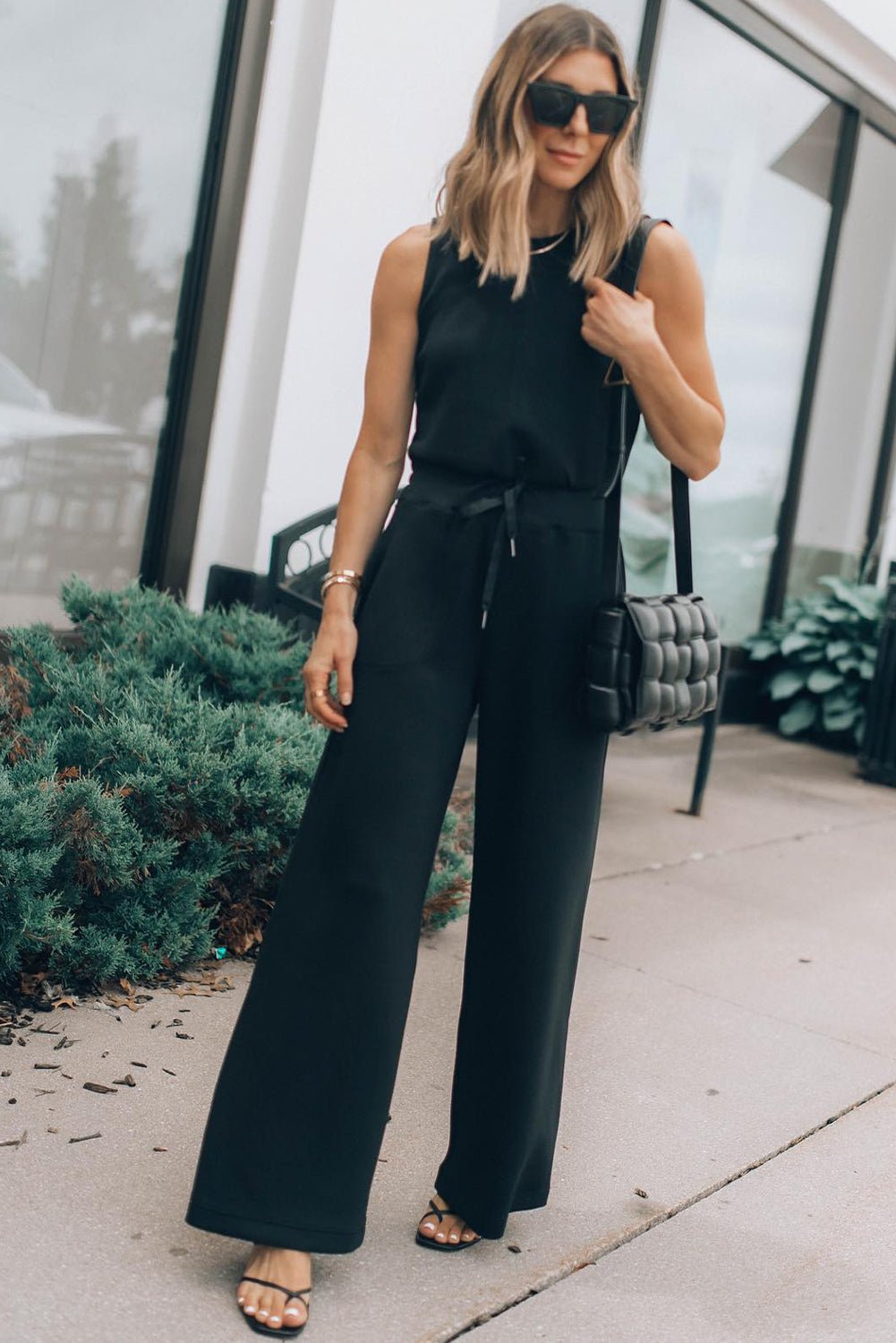 Modern Elegance: Sleeveless Wide-Leg Tank Jumpsuit in Classic Solid Black - The Charming Petite