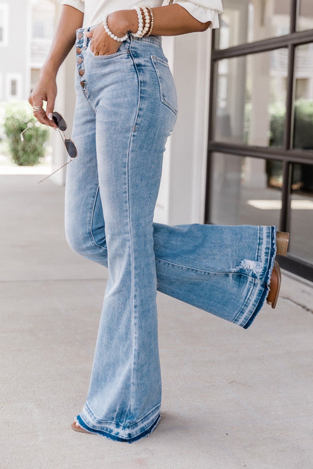 Petite Blue Light Wash High Waisted Button Bell Bottom Jeans Side View- The Charming Petite